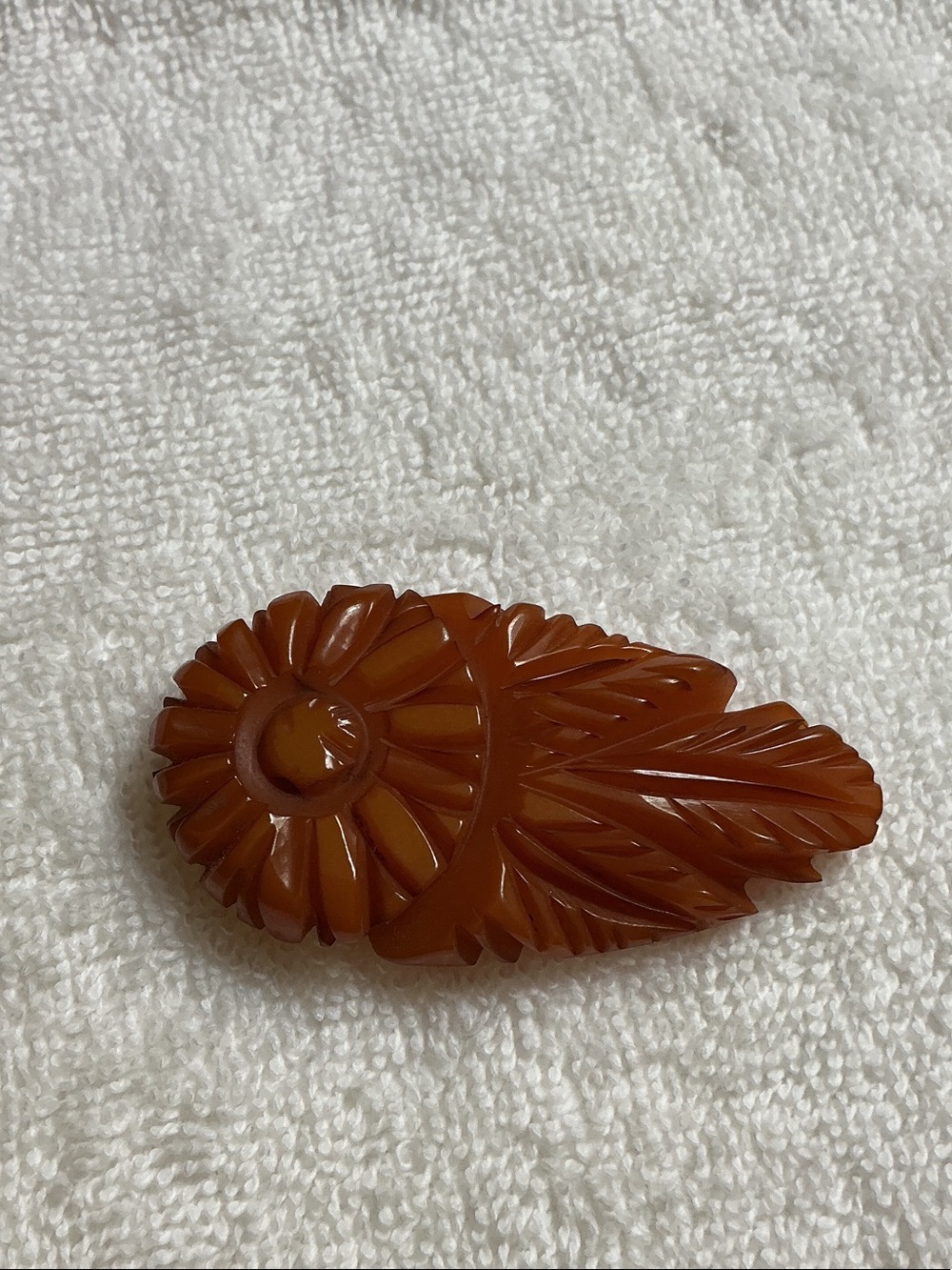 Carved Floral Leaf Brooch in butterscotch amber